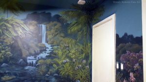 Enchanted Forest Mural: A palm painted over three surfaces to soften the corner